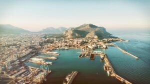 Stunning aerial view of Palermo's harbor with Monte Pellegrino in Sicily, Italy, under daylight.